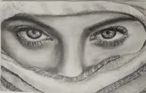 Detailed charcoal drawing of expressive eyes and eyebrows with fabric head covering, showcasing realistic shading and fine art technique